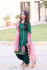 Green suit with contrasted pink net dupatta