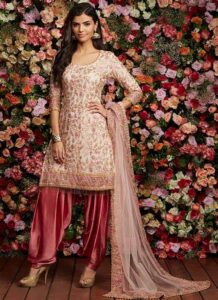 Straight suit with tassels and embellishments