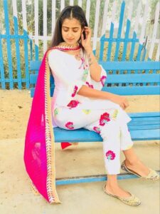 White floral suit with pink dupatta