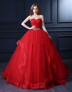 Red netted ball gown dress with an embellished belt