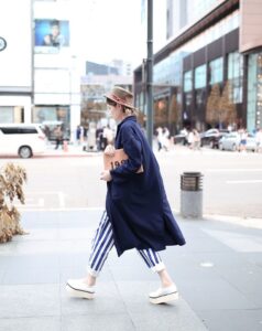 Striped trousers with a trench coat